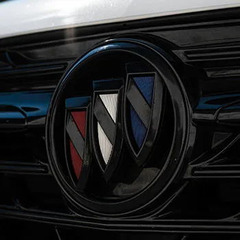 Buick car emblem on vehicle grille close-up.